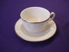 Coffee cup and saucer with gold trim