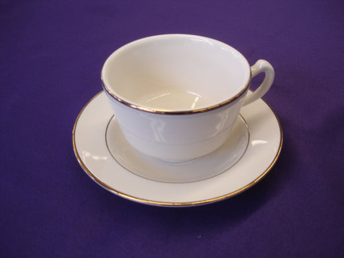 Coffee cup and saucer with gold trim